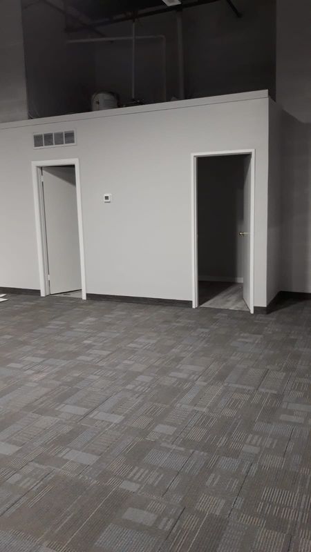 Finished commercial office space with new carpet tile and painted walls