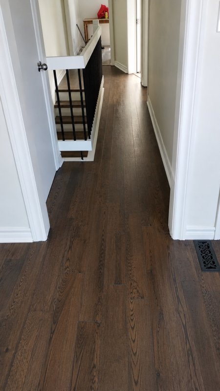 Finished hardwood floor after sanding staining and varnish