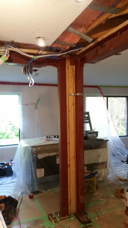 Open concept renovation before - structural steel beam install removing load bearing wall