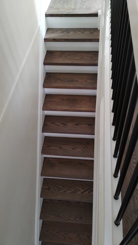 Stained and varnished stair treads — custom railing build