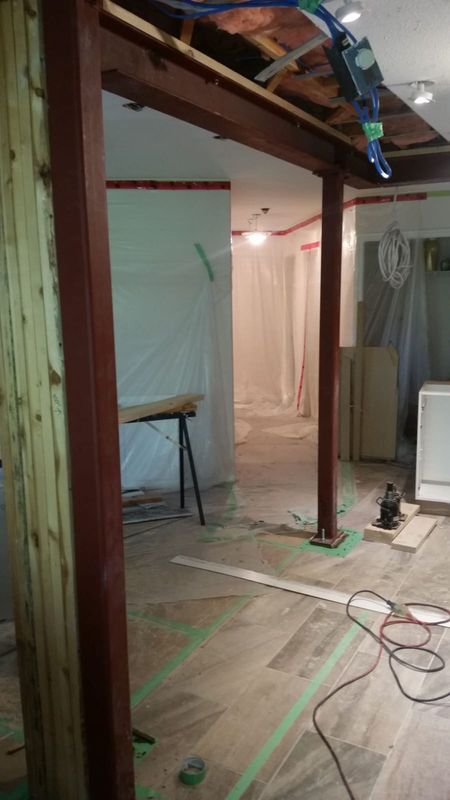 Structural beam installation in progress for open concept conversion